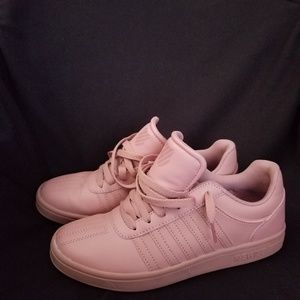 Pale pink KSwiss sneakers.